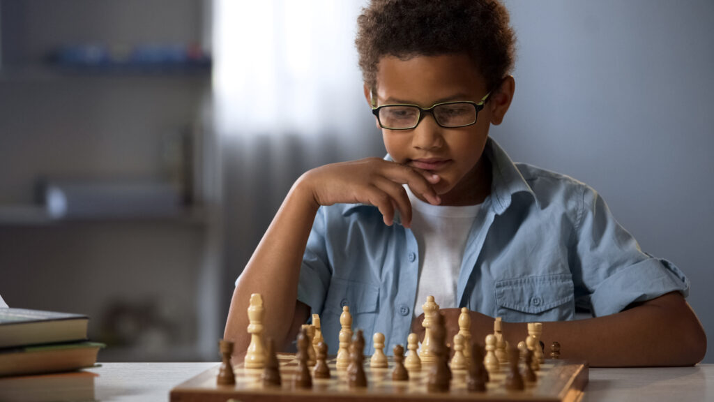 A boy playing chess