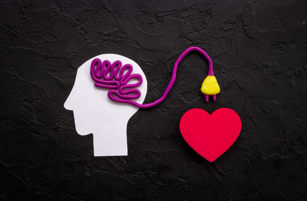 The brain connecting to a paper heart