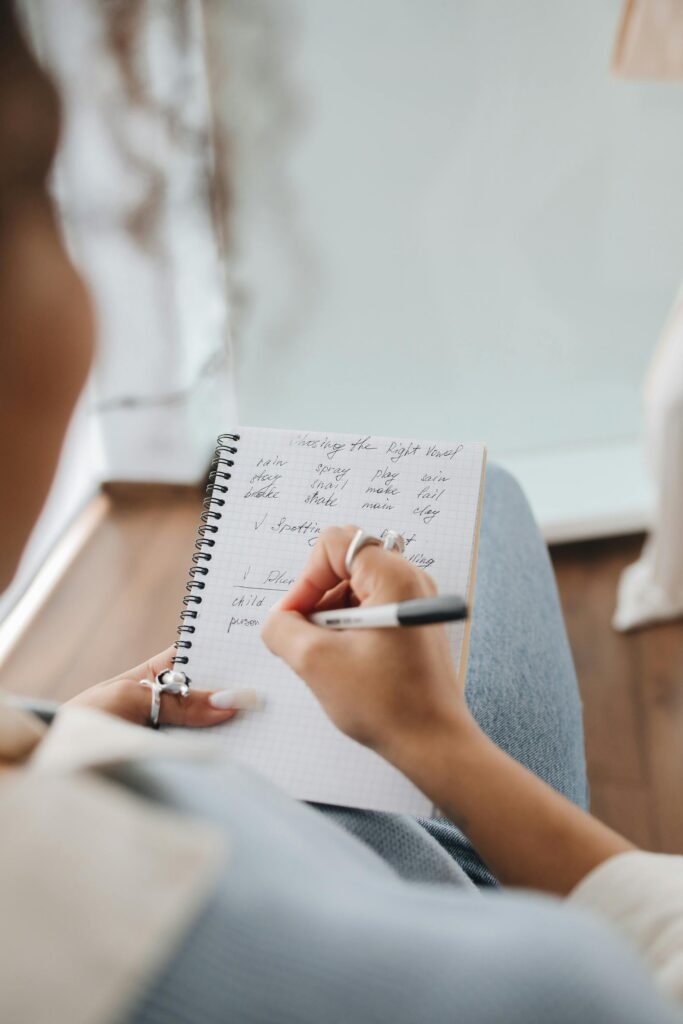 A girl's hand writing a note