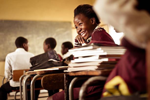 A school girl laughing in class