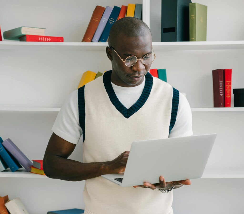 A teacher with checking his laptop.