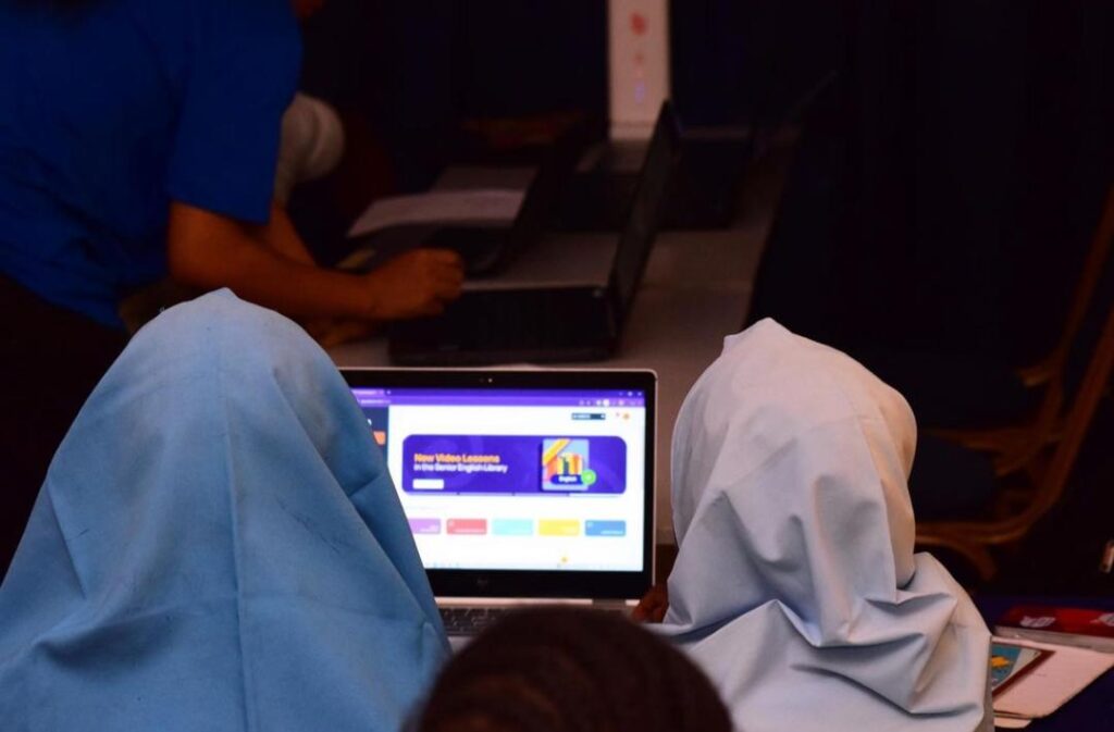 Students using the uLesson app on a laptop