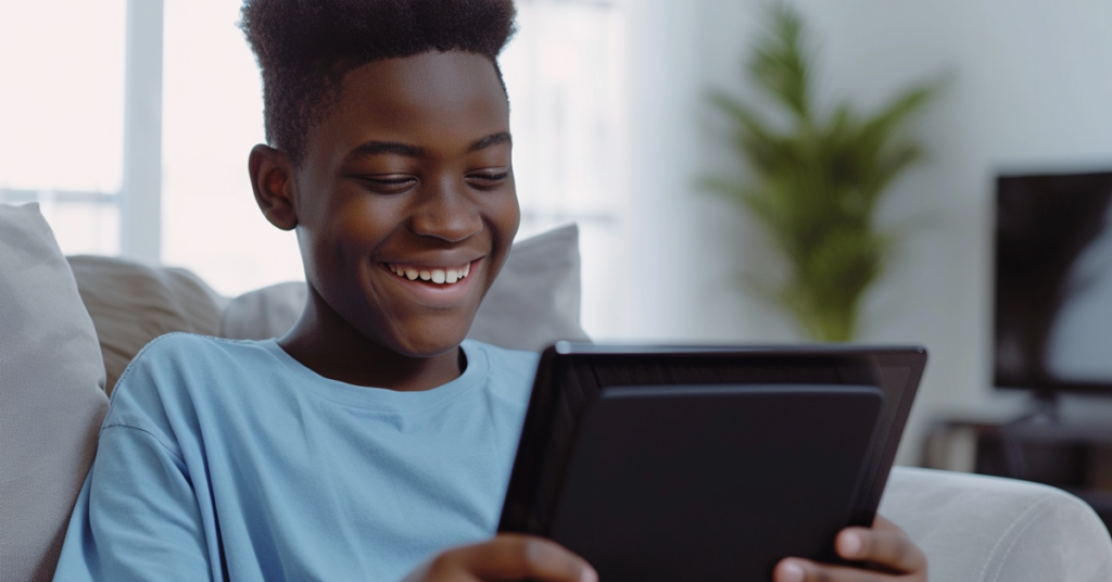 A boy watching a video on a tablet